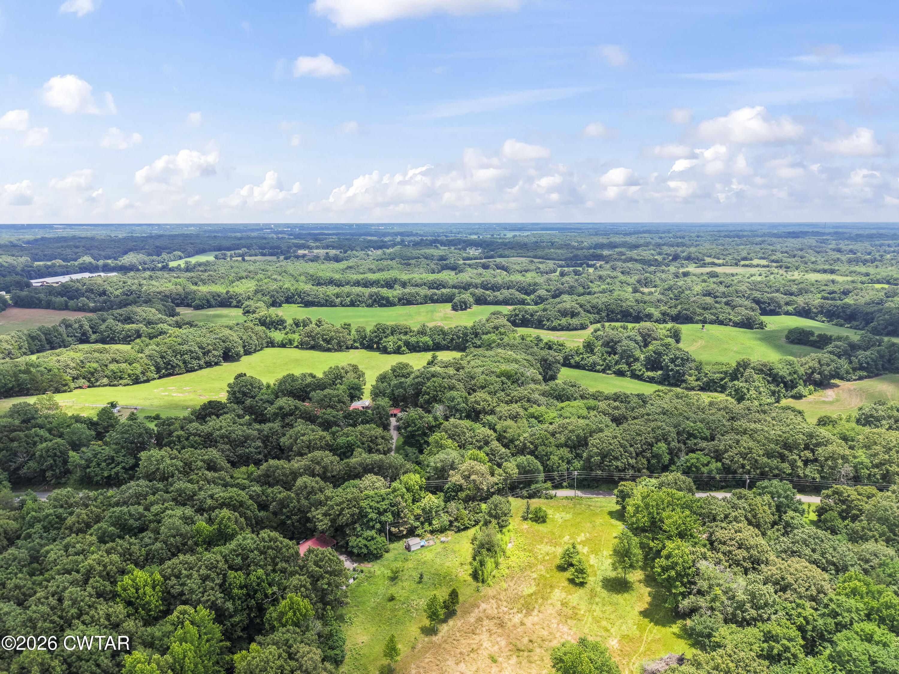 0 Aubrey Ferguson Road Gadsden, TN 38337 - Photo 15 of 15 a view of a city with lush green forest