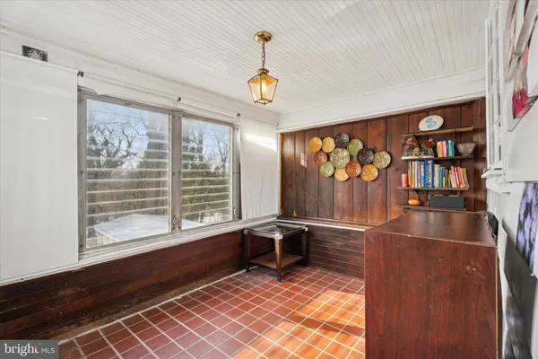 a view of room with window and wooden floor