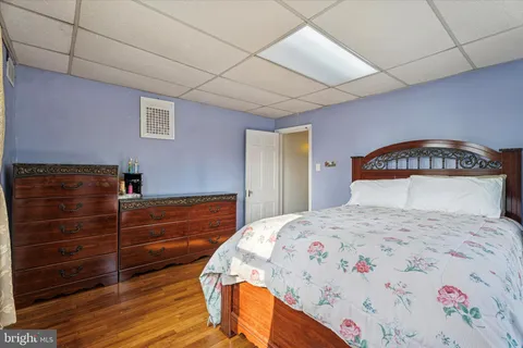 a bedroom with a bed and a dresser