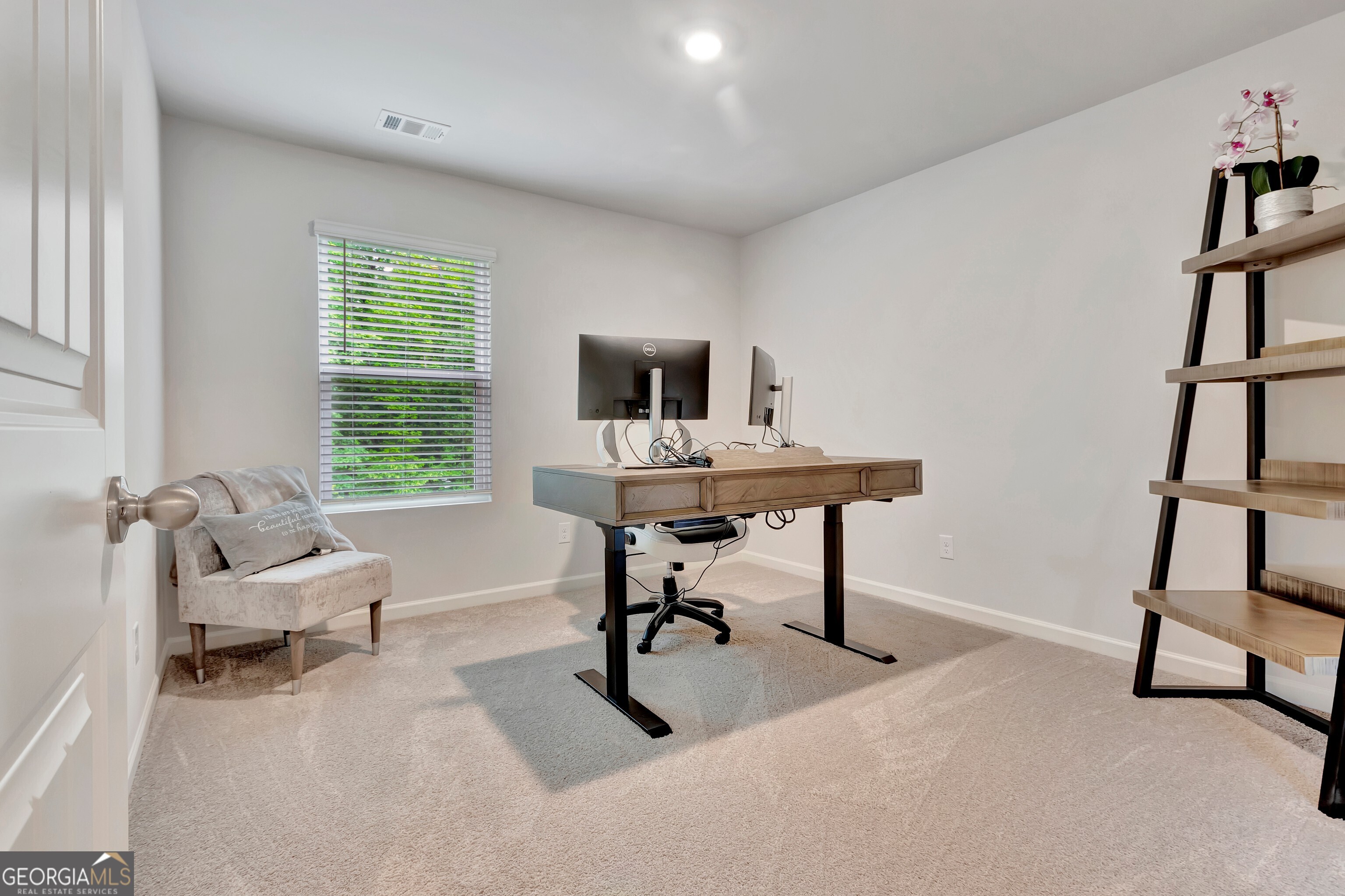 7730 Demeter Drive Fairburn, GA 30213 - Photo 27 of 47 a view of a livingroom with workspace and a window