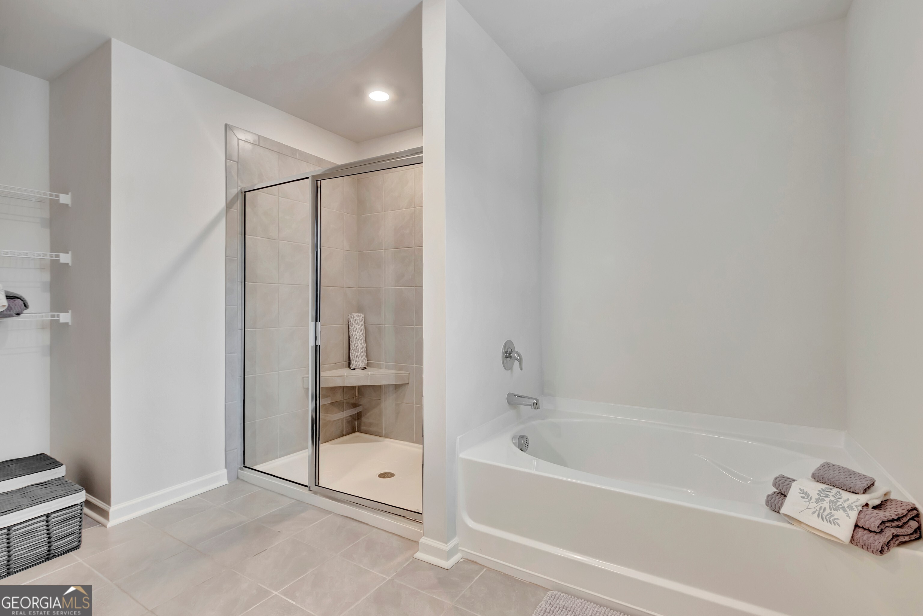 7730 Demeter Drive Fairburn, GA 30213 - Photo 35 of 47 a bathroom with a bathtub and a shower