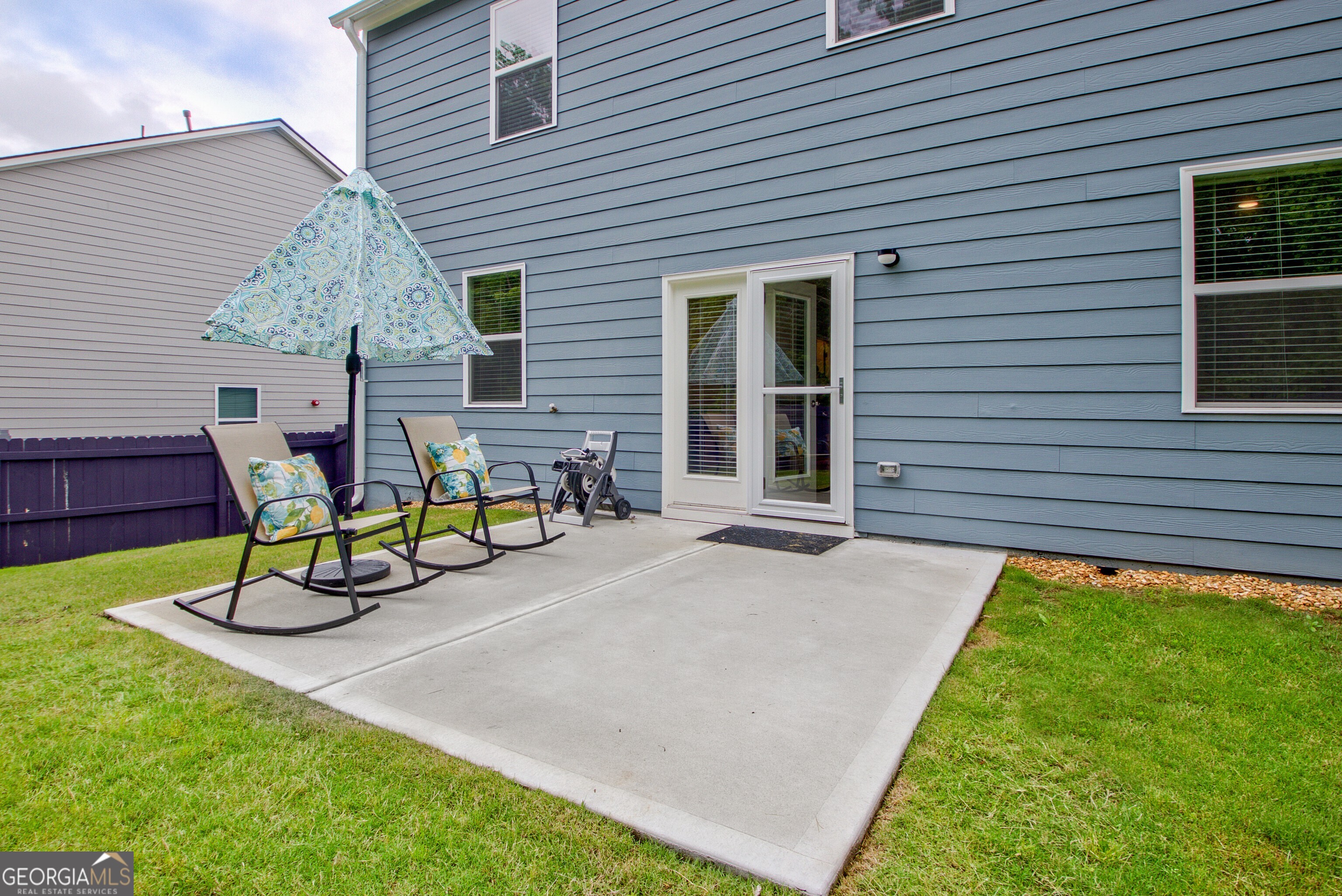 7730 Demeter Drive Fairburn, GA 30213 - Photo 38 of 47 a view of a house with backyard and sitting area