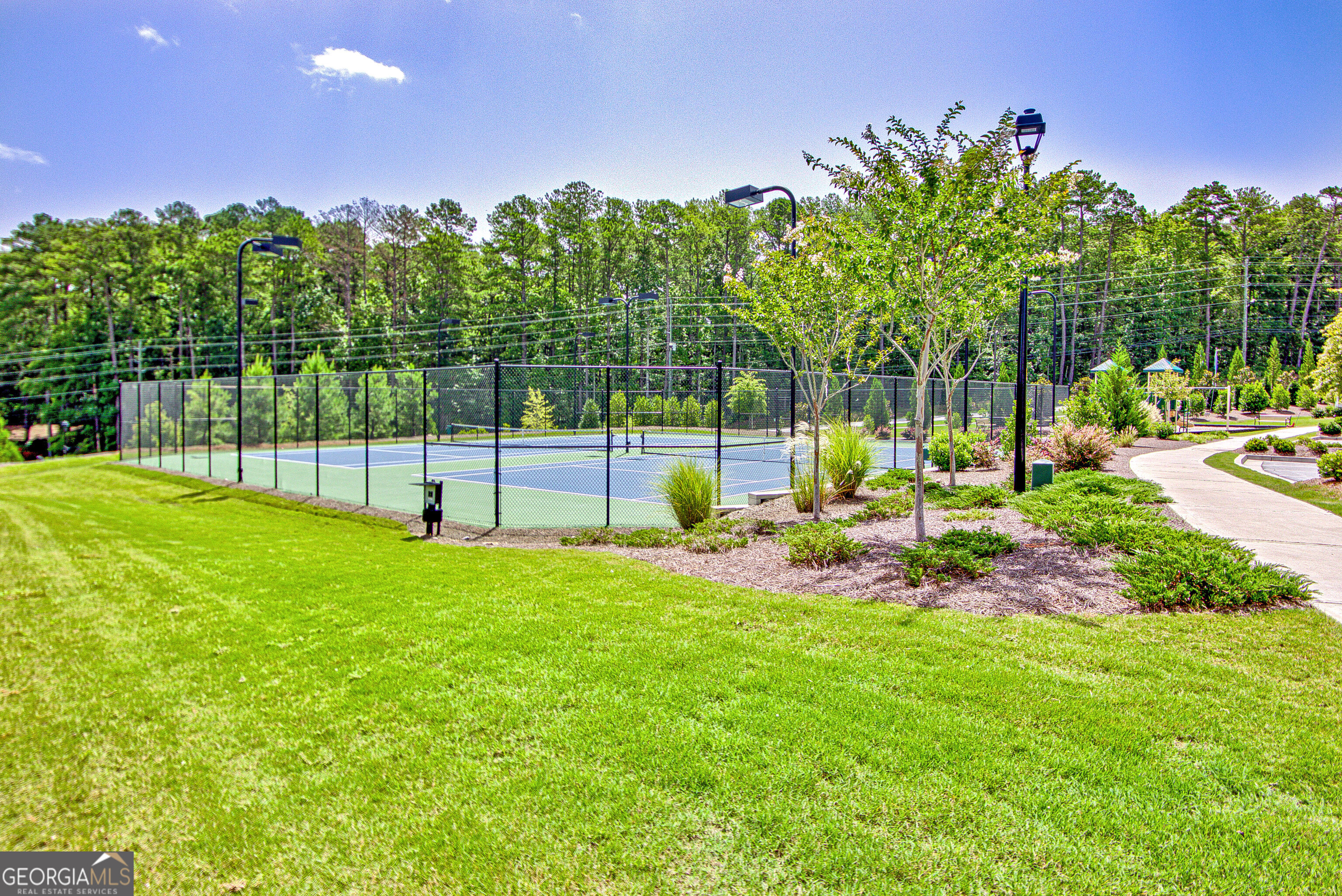 7730 Demeter Drive Fairburn, GA 30213 - Photo 43 of 47 a view of a backyard with sitting area