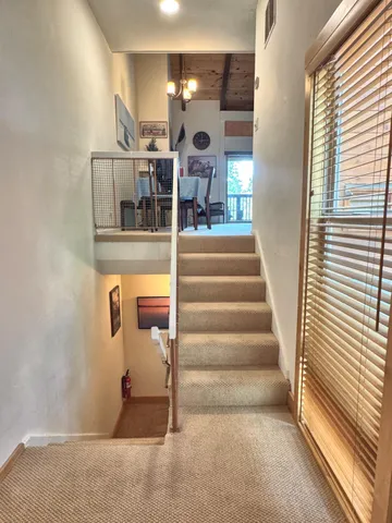 a view of balcony with wooden floor