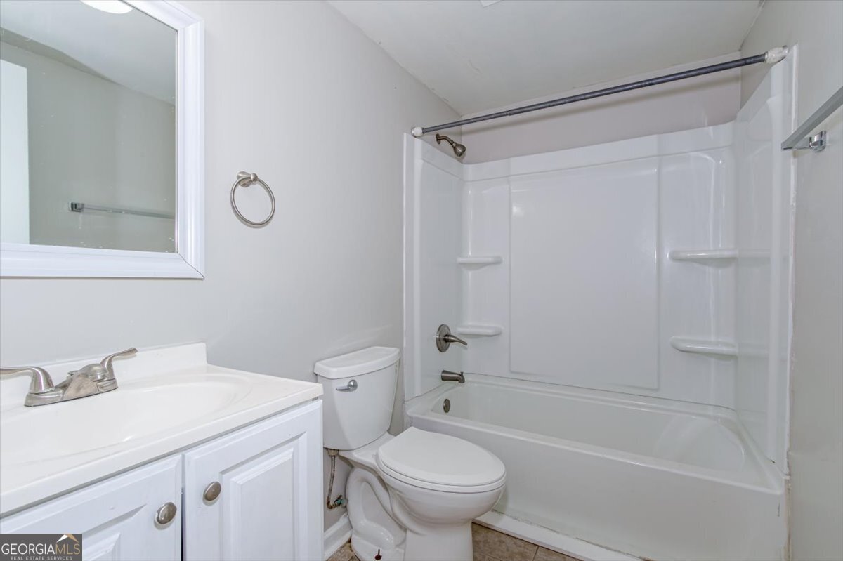 1232 12th Street, Unit F Augusta, GA 30901 - Photo 14 of 27 a bathroom with a sink toilet and shower