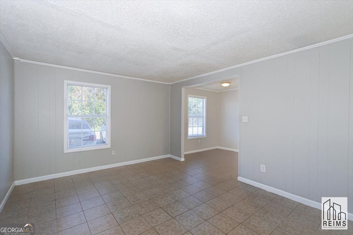 1232 12th Street, Unit F Augusta, GA 30901 - Photo 15 of 27 a view of an empty room with a window