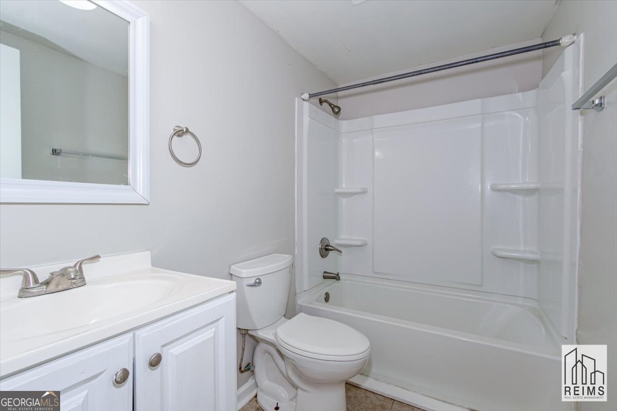 1232 12th Street, Unit F Augusta, GA 30901 - Photo 26 of 27 a bathroom with a sink toilet and shower