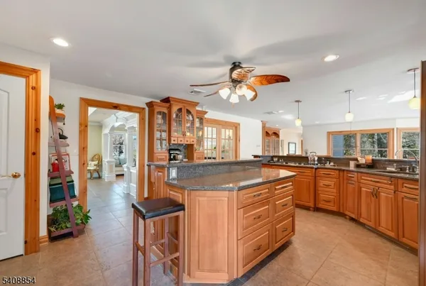 a kitchen with stainless steel appliances granite countertop a stove and a sink