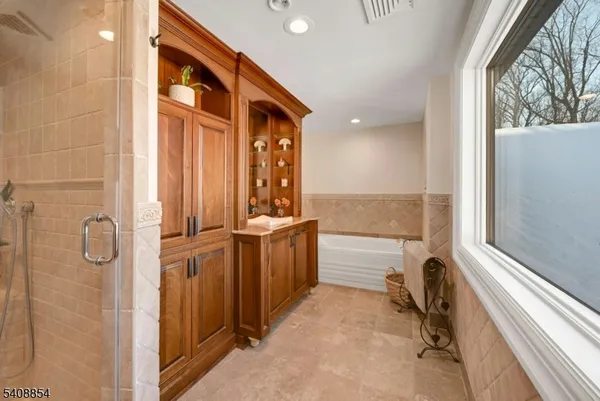 a bathroom with a bathtub and a sink