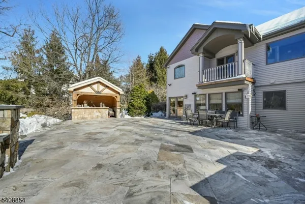 a front view of a house with sitting area