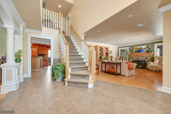 a view of a livingroom with furniture and an empty room