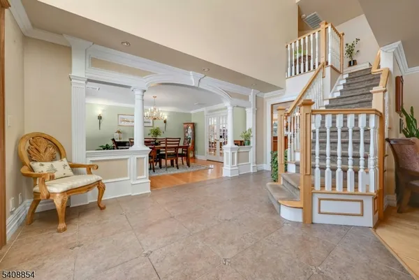 a view of a livingroom with furniture and stairs