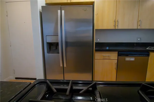 a view of a house with a yard and large trees