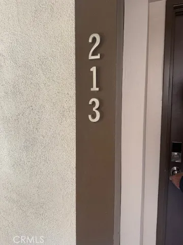 a kitchen with stainless steel appliances granite countertop a refrigerator a stove and a sink with wooden floor