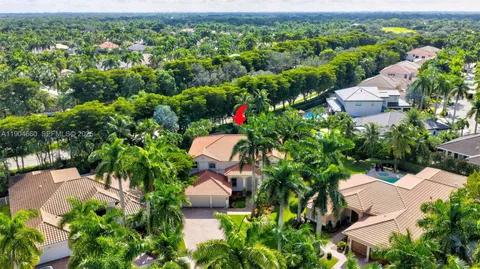 an aerial view of a house with yard