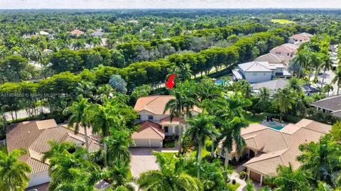an aerial view of a house with yard