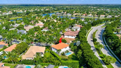 an aerial view of residential houses with outdoor space and street view