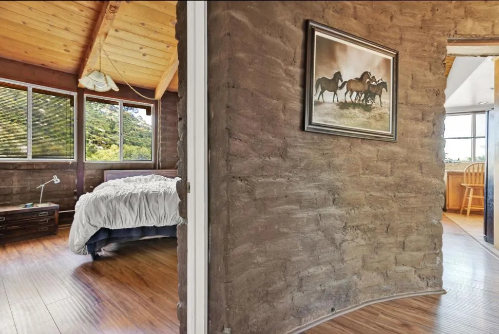2951 Miramontes Road Jamul, CA 91935 - Photo 14 of 24 a bed sitting in a bedroom next to a window