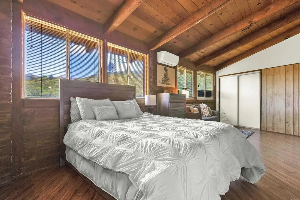 2951 Miramontes Road Jamul, CA 91935 - Photo 20 of 24 a large bed sitting in a bedroom next to a large window