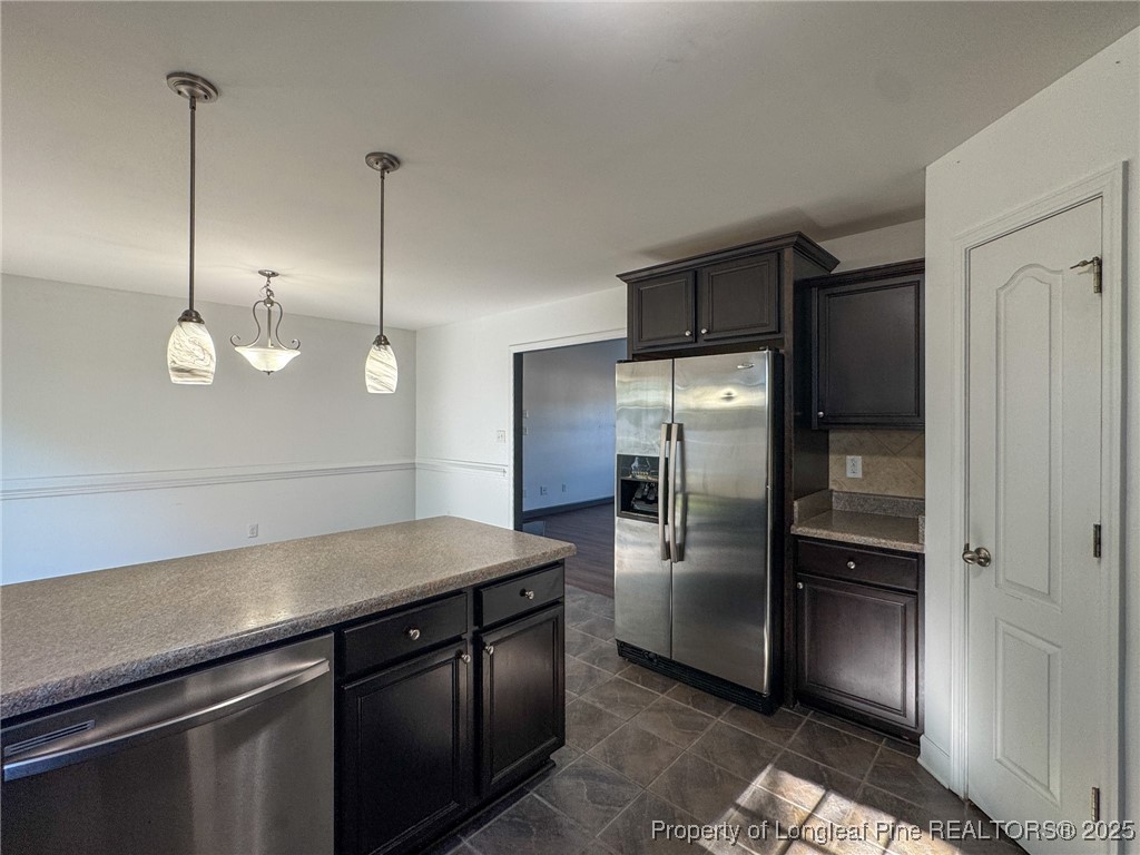 142 Crestwood Lane Raeford, NC 28376 - Photo 16 of 30 a kitchen with a refrigerator and a sink