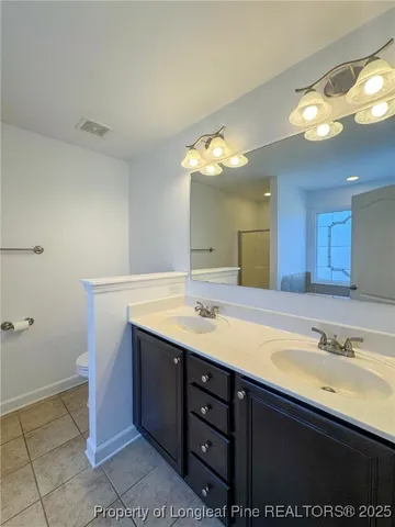 a bathroom with a sink a vanity and a mirror