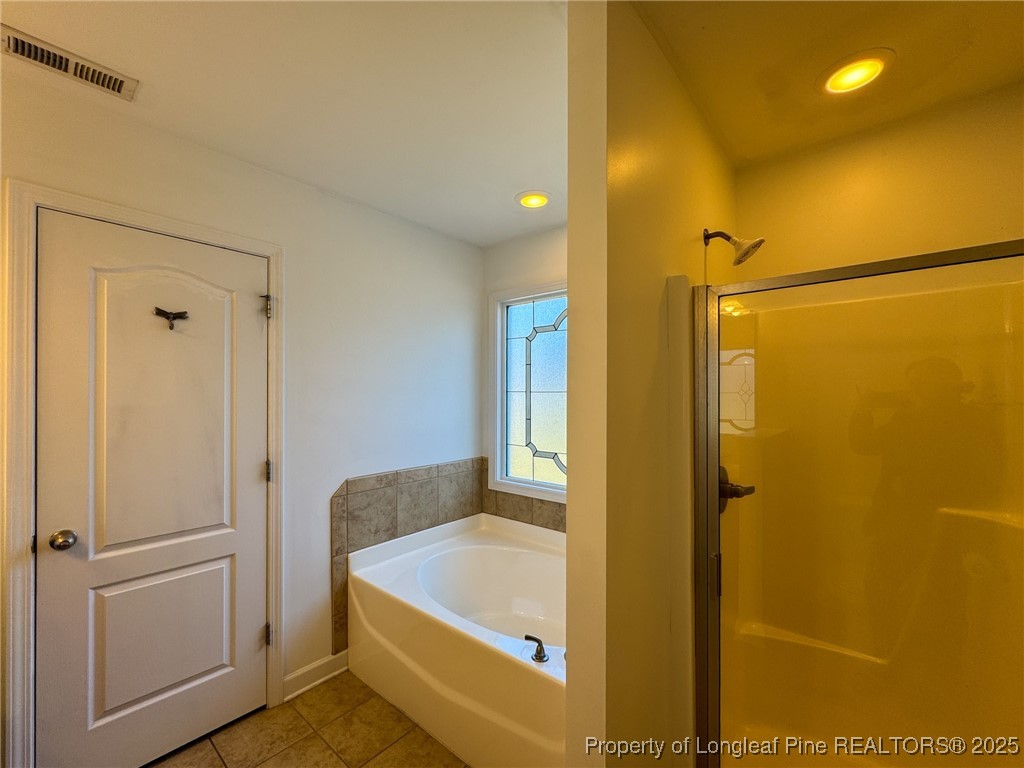 142 Crestwood Lane Raeford, NC 28376 - Photo 24 of 30 a bathroom with a tub and shower