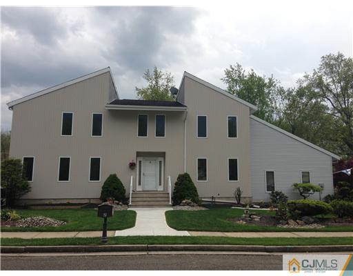 2 Mindy Road Edison, NJ 08820 - Photo 1 of 25 a front view of house with yard