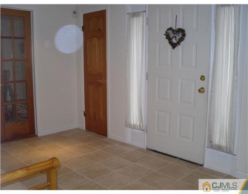 2 Mindy Road Edison, NJ 08820 - Photo 2 of 25 a view of a hallway with a elevator