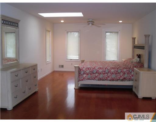 2 Mindy Road Edison, NJ 08820 - Photo 15 of 25 a living room with furniture and a wooden floor