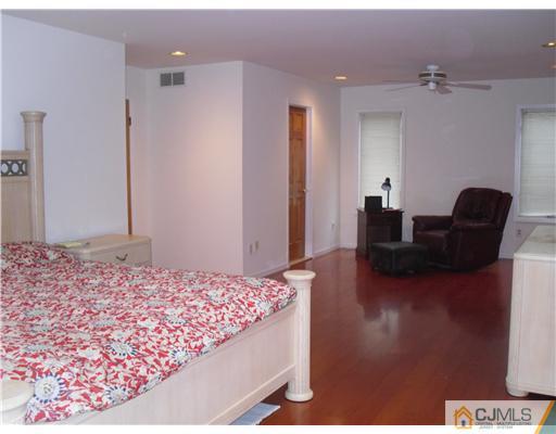 2 Mindy Road Edison, NJ 08820 - Photo 16 of 25 a bedroom with a bed and furniture