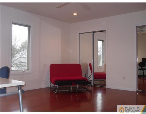 2 Mindy Road Edison, NJ 08820 - Photo 20 of 25 a room with furniture and wooden floor