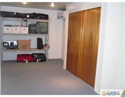 2 Mindy Road Edison, NJ 08820 - Photo 23 of 25 a view of a bedroom with closet and cabinet