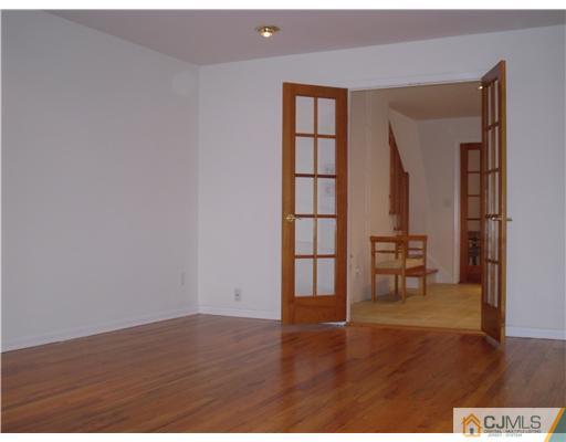 2 Mindy Road Edison, NJ 08820 - Photo 4 of 25 a view of wooden floor and windows in a room