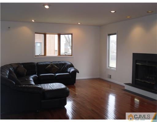 2 Mindy Road Edison, NJ 08820 - Photo 6 of 25 a living room with furniture and a fireplace