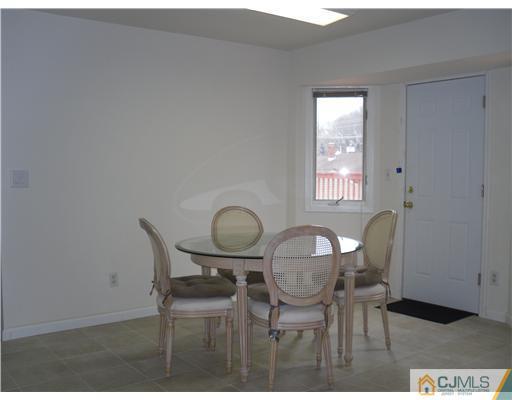 2 Mindy Road Edison, NJ 08820 - Photo 8 of 25 a view of a dining room with furniture and wooden floor