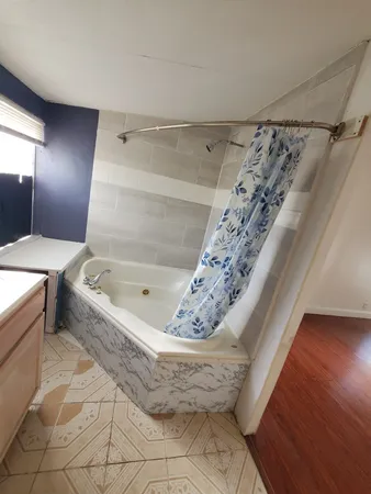 a view of a bathtub in a bathroom