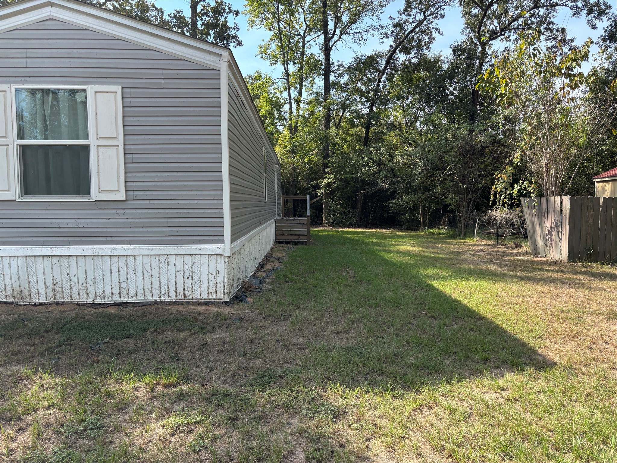 1311 Big Hawg Road Trinity, TX 75862 - Photo 2 of 22 Side yard with small deck.