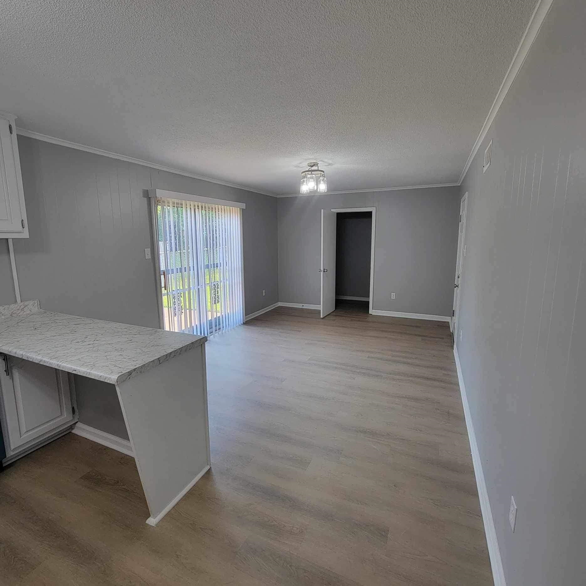 222 Pickett Road Memphis, TN 38109 - Photo 8 of 8 an empty room with windows