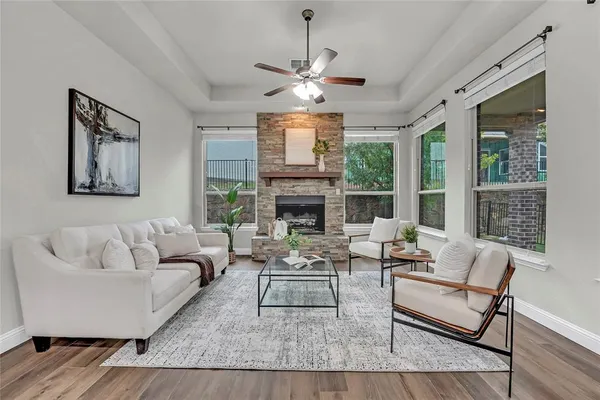 a view of a dining room with furniture and wooden floor