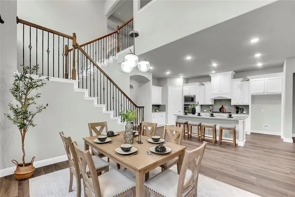 a living room with furniture a large window and a fireplace