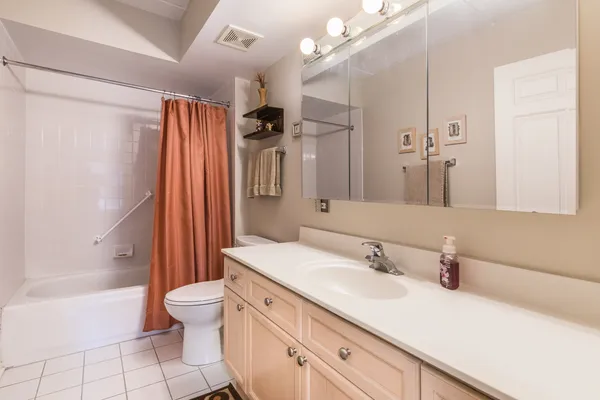 a bathroom with a sink a toilet and a bathtub