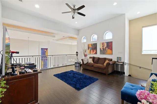 a living room with furniture window and wooden floor