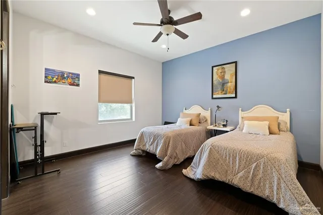 a bedroom with two beds and a window