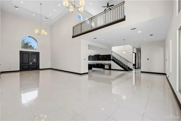 a view of a livingroom with furniture and a hallway