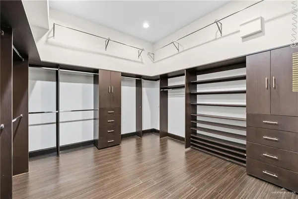 a view of a room with wooden floor