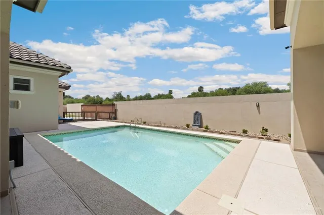 a view of a terrace with outdoor seating and lake view