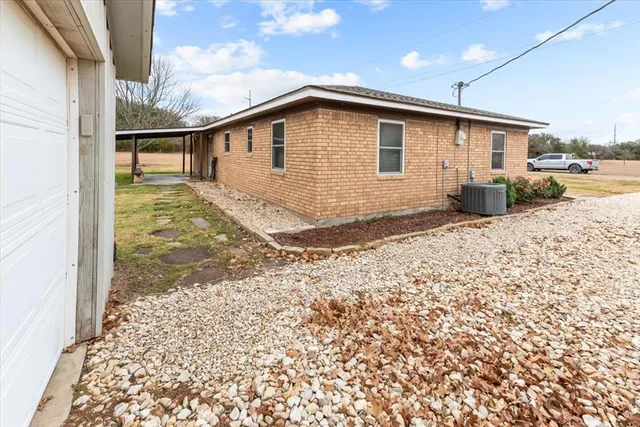 a view of a house with a snow in the yard