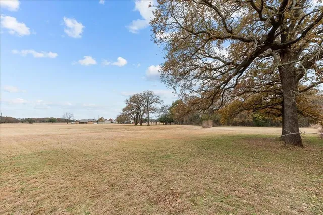a view of an ocean and a yard