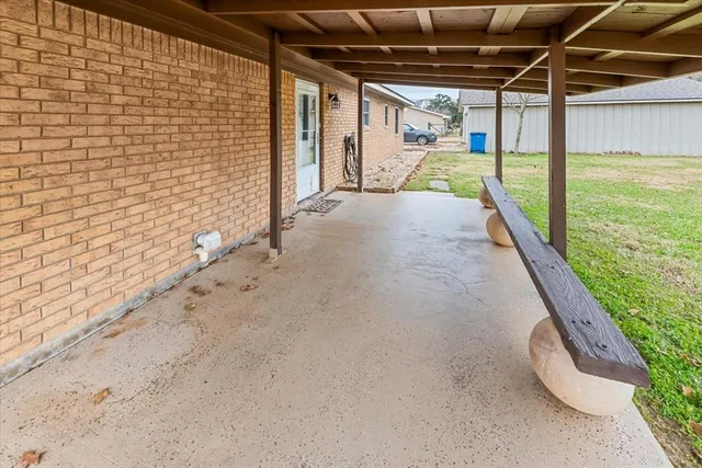 a view of swimming pool with a patio