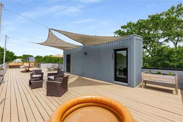 a view of swimming pool with outdoor seating and plants